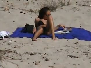 Girl Filmed While She Lays on the Beach